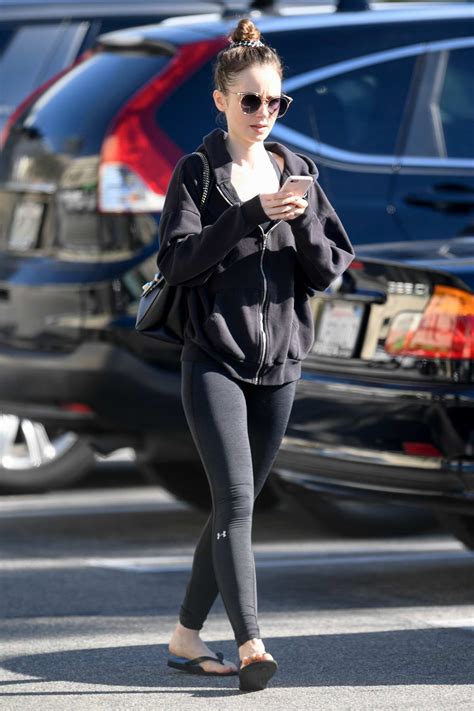 Lily Collins Spotted Leaving The Gym Wearing A Black Hoodie With