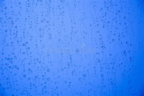 Rain Drops On Glass After Rain Abstract Blue Background Stock Photo