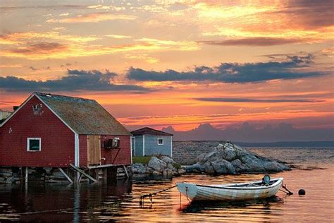 Peggys Cove Harbor In Nova Scotia Canada Last Light With Red Sunset
