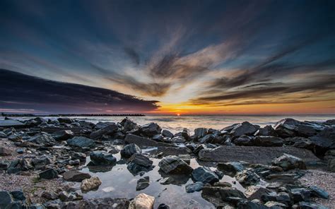 Download 1920x1200 Wallpaper Rocks Sea Coast Sky Sunset Widescreen