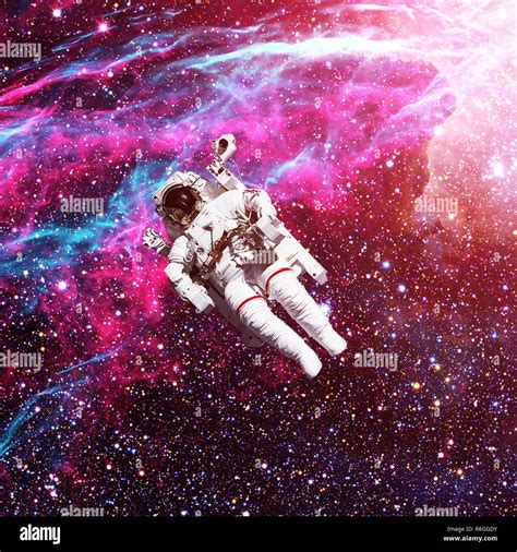 Astronaut In Outer Space Nebula On The Background Stock Photo Alamy