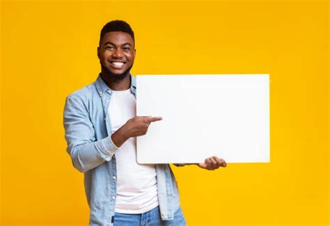 245300 Guy Holding Sign Stock Photos Pictures And Royalty Free Images