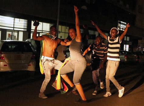 celebrations erupt in zimbabwe s capital after robert mugabe announces his resignation