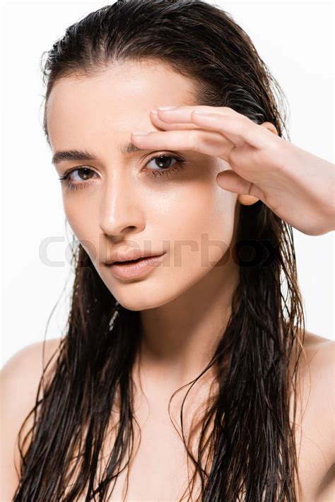 Beautiful Wet Nude Young Woman With Hand Near Face Looking At Camera Isolated On White Stock