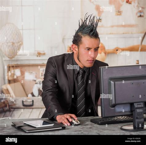 Close Up Of Office Punk Worker Wearing A Suit With A Crest Working In