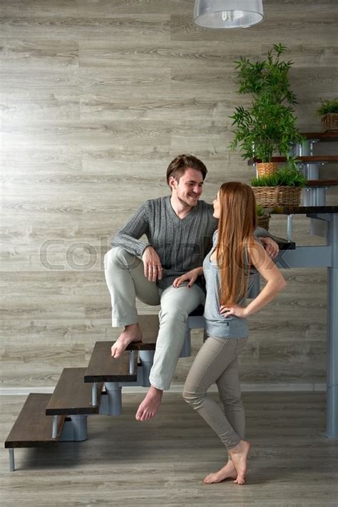 Young Couple Hugging While Sitting On Stock Image Colourbox