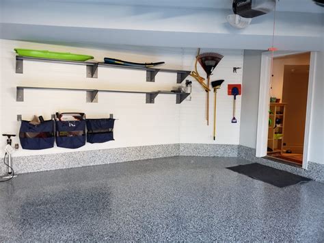 Maple slatwall was install above a butcher block counter top along with under cabinet lighting. Garage Slatwall | Garage organization, Slat wall, Garage ...