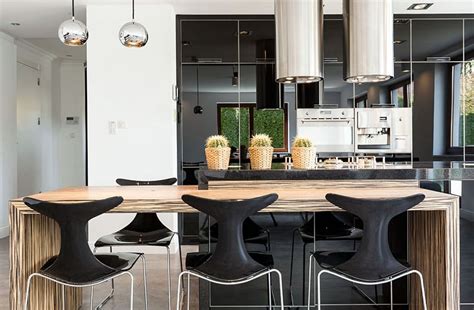 The matte black backsplash helps the space from becoming too busy, and the wood floor keeps the space inviting. Beautiful Black Kitchen Cabinets (Design Ideas ...