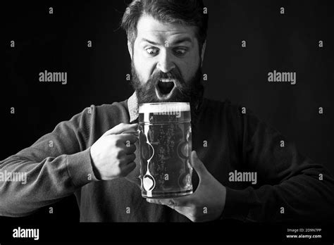 Emotional Funny Bearded Drunk Hipster Holds Craft Bottled Beer Happy