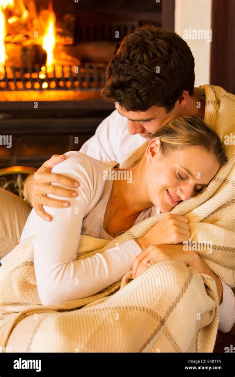 Couple Cuddling Fireplace Hi Res Stock Photography And Images Alamy