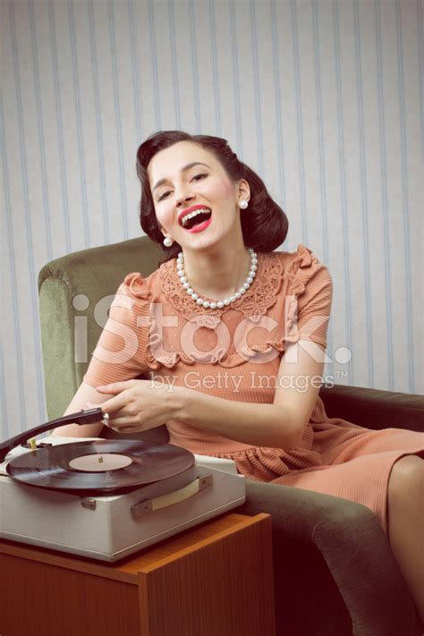 Young Woman Listening To Music From A Turntable Stock Photo Royalty
