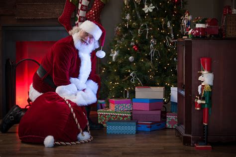 Santa Claus Enjoys Delivering Ts Stock Photo Download Image Now