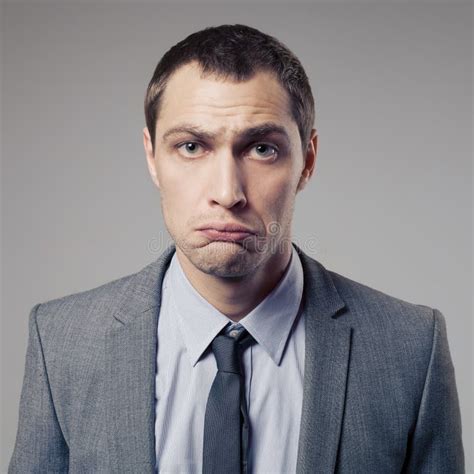 Confused Businessman On Gray Background Stock Photo Image Of Crazy