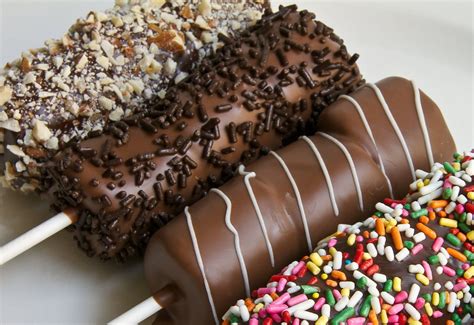 Each Pop Is Made With Three Marshmallows Hand Dipped In Your Choice Of Chocolate And Rolled In