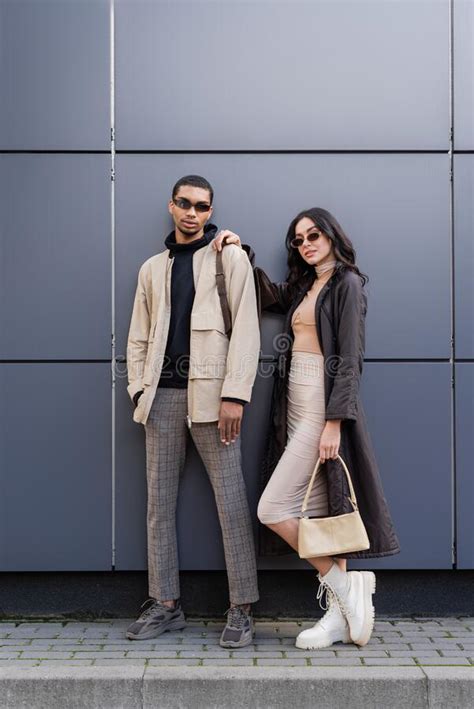 full length of stylish interracial couple stock image image of grey clothes 256446137