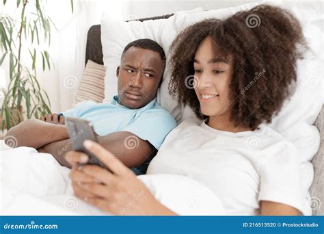 jealous husband watching his wife using mobile phone royalty free stock image cartoondealer