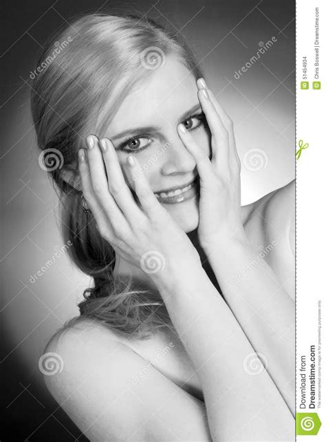 Beautiful Woman Happy Smiling Holds Hands Over Face Embarrassed Stock