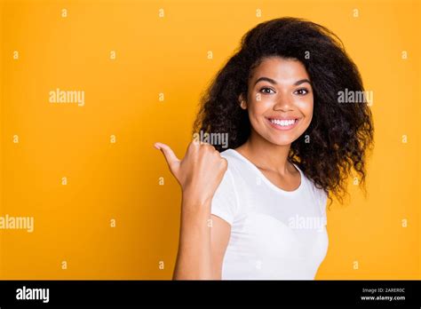 Photo Of Trendy Cheerful Positive Nice Pretty Cute Black Girl Pointing