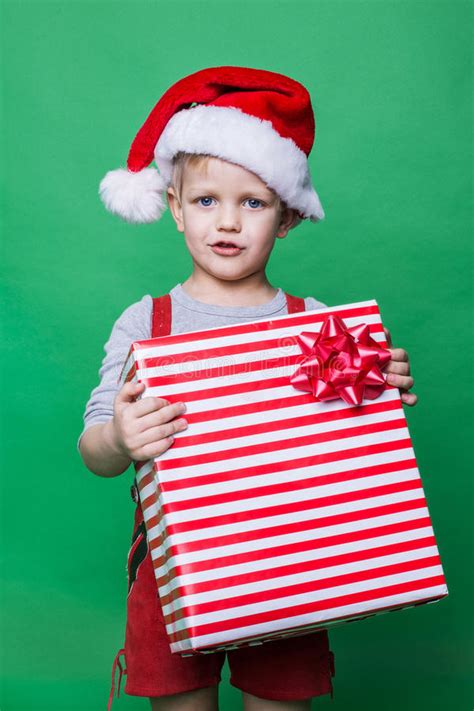 Christmas Elf Holding Big Red T Box With Ribbon Santa Claus Helper