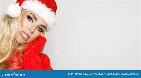 Beautiful Blonde Female Model Dressed In A Santa Claus Hat Christmas Stock Photo Image Of Eyes