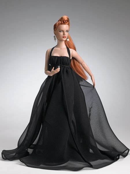 a doll with red hair wearing a black dress