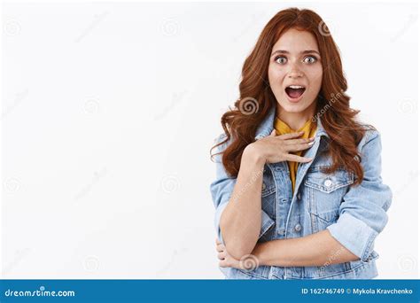 Surprised Attractive Redhead Girl In Denim Jacket Look Ambushed And Impressed Touch Chest From