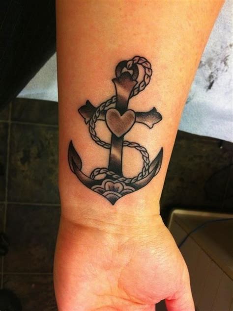 When the anchor is dropped, the water cannot budge the boat. Cute cross-shaped black anchor with heart tattoo on wrist ...