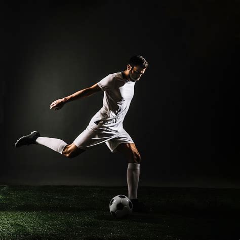 Soccer Player Shooting Ball Free Photo