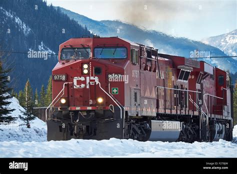 Canadian Pacific Train With Canadian Rockies In The Background In