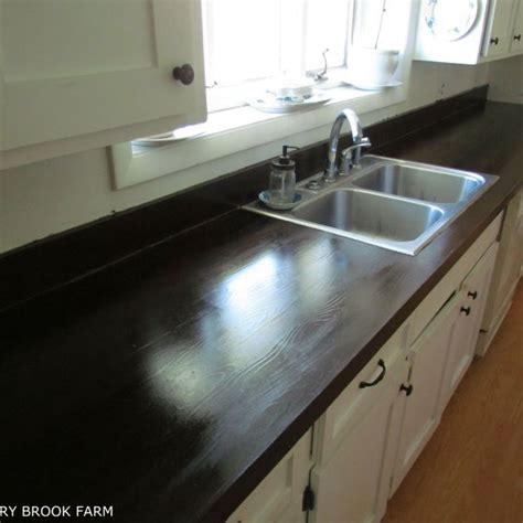 For example, a white formica countertop with gray and black veins made to look like marble will look. HOW TO MAKE LAMINATE COUNTERTOPS LOOK LIKE WOOD | Laminate ...