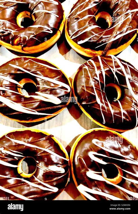 Chocolate Iced Donuts Stock Photo Alamy