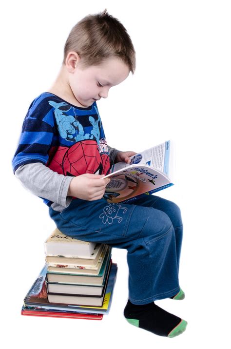 Schoolboy Is Sitting On Books Free Stock Photo Public Domain Pictures