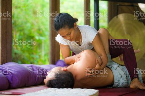 Young Beautiful And Exotic Asian Indonesian Therapist Woman Giving