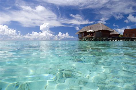 photo maldives spa town bungalow sea nature sky water clouds
