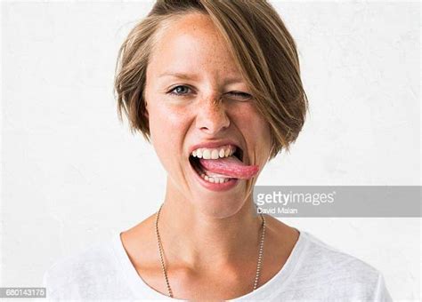 Woman Sticking Out Tongue Photos And Premium High Res Pictures Getty Images