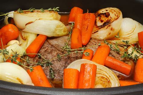 Pour on the pan drippings and then add in the onions, carrots, potatoes, garlic, and fresh herbs. For the Love of Food: The Pioneer Woman's Perfect Pot Roast