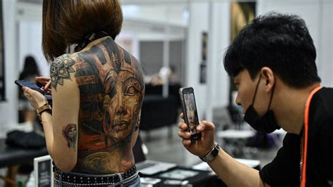 Malaysian Minister Criticises Obscene Half Naked Tattoo Show In