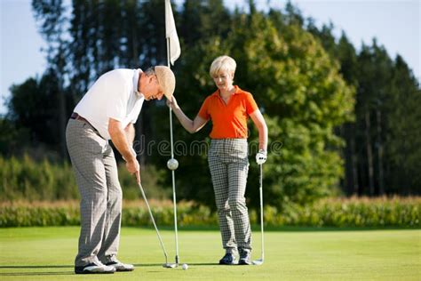 Mature Couple Playing Golf Royalty Free Stock Photo Image 12384765