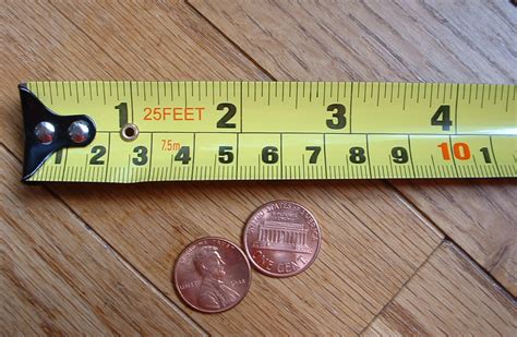 How to convert 320 inches to centimetres? File:Measuring Tape Inch+CM.jpg - Wikimedia Commons