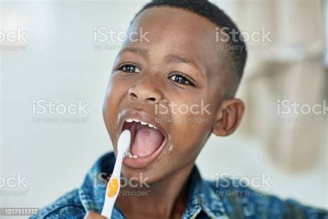 Young African Boy Brushing Teeth Stock Photo Download Image Now