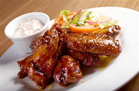 Roasted Chicken Wings On Plate — Stock Photo © Fanfon 27861613