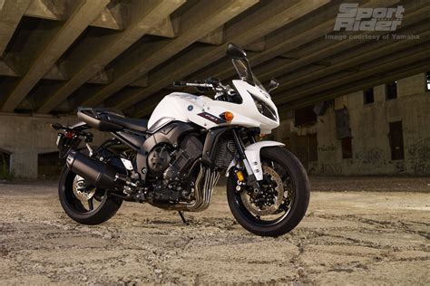 It's sporty heritage is stressed by the aggressive 51 percent front wheel weight bias, and the short fuel tank allowing the rider to move into a forward position. 2012 Yamaha FZ1 Wallpaper | Yamaha, Yamaha motorbikes ...