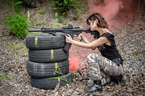 620 Woman Shooting Machine Gun Stock Photos Pictures And Royalty Free