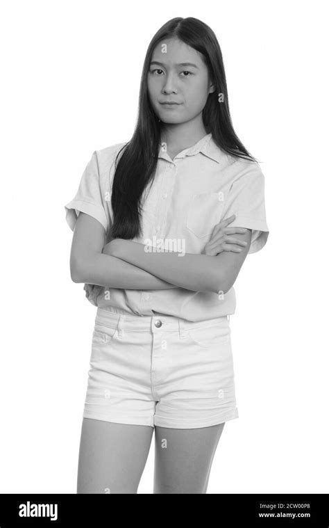 Portrait Of Young Beautiful Asian Teenage Girl With Arms Crossed Stock