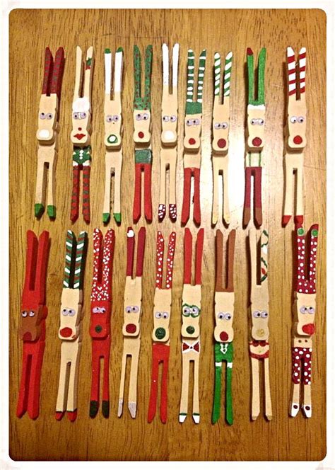 Many Wooden Toy Figures Are Lined Up On A Wood Table With Red Green