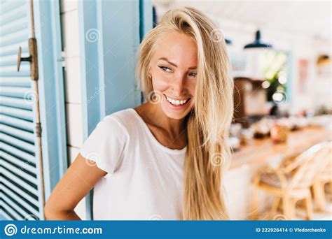 Pleased Blue Eyed Woman Playfully Looking Away Indoor Photo Of Elegant