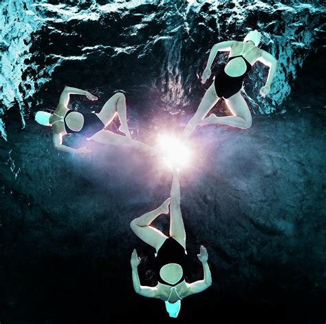Three Synchronised Swimmers In Formation Photograph By Henrik Sorensen
