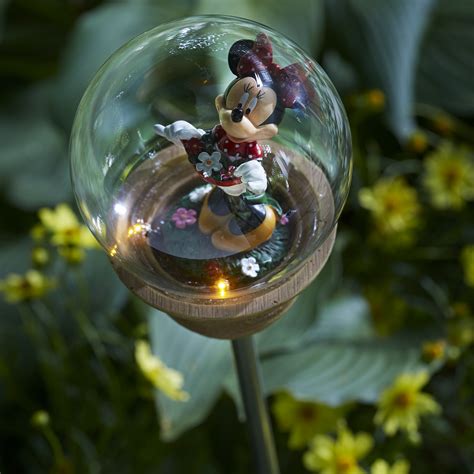 An enchanting fairy scene is brought together with gently flowing water to make a sweet focal point in your garden and outdoor spaces. Disney Minnie Mouse Solar Garden Stake - Outdoor Living - Outdoor Decor - Lawn Ornaments & Statues