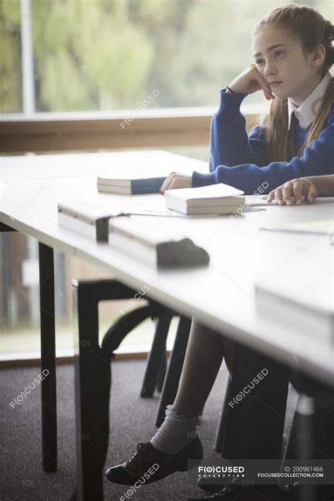 Elementary School Girl Looking Bored In Classroom — Caucasian Ethnicity