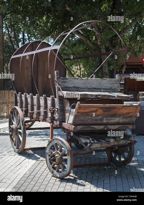 Antique Wooden Wagon With Wheels And Metal Structure Stock Photo Alamy